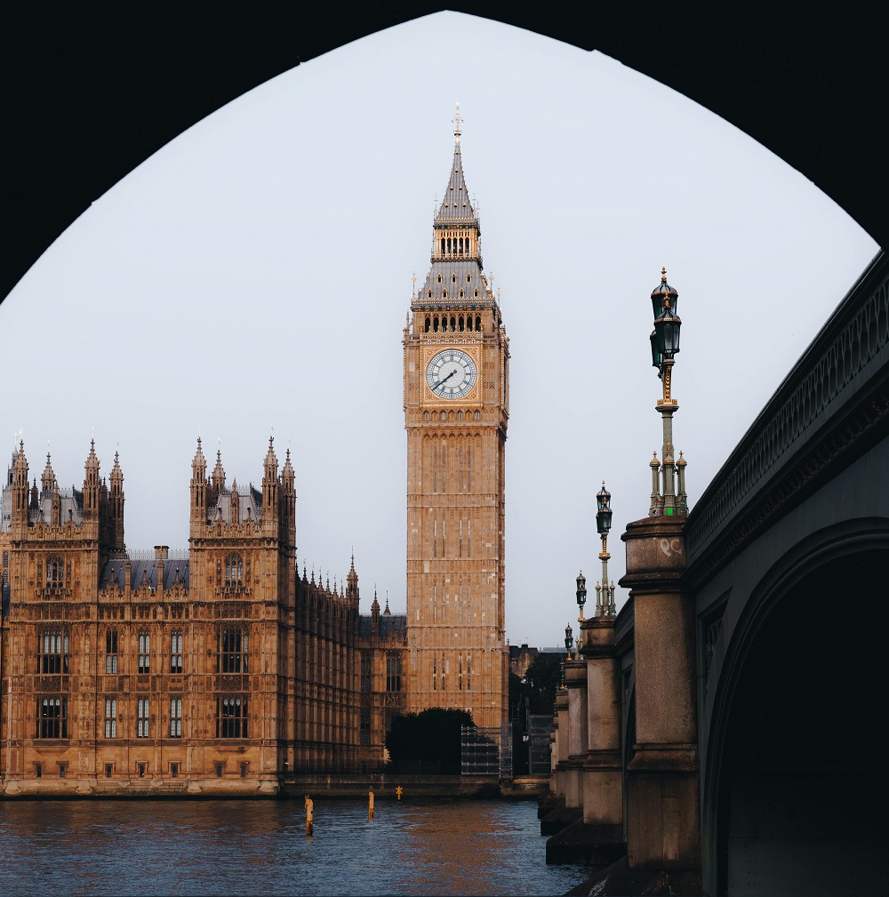 Big Ben and Houses of Parliament viewed through bridge arch in London